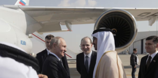 Russian President Vladimir Putin is welcomed by Minister of Foreign Affairs of the United Arab Emirates Sheikh Abdullah bin Zayed bin Sultan Al Nahyan upon arrival at the Abu Dhabi International Airport, United Arab Emirates December 6, 2023. Sputnik/Andrey Gordeev/Pool via REUTERS Acquire Licensing Rights