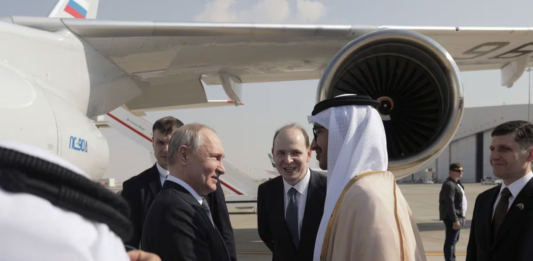 Russian President Vladimir Putin is welcomed by Minister of Foreign Affairs of the United Arab Emirates Sheikh Abdullah bin Zayed bin Sultan Al Nahyan upon arrival at the Abu Dhabi International Airport, United Arab Emirates December 6, 2023. Sputnik/Andrey Gordeev/Pool via REUTERS Acquire Licensing Rights