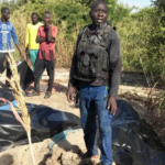 A man stands next to body bags of farmers that were victims of an attack, in the Zabarmari district, near Maiduguri, on November 6, 2023. Audu Marte | Afp | Getty Images