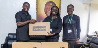 Dr Gideon Boako, spokesperson for the Vice- President (left) presenting one of the laptops to Prof Rita Akosua Dickson, Vice-Chancellor of the KNUST (second from right). With them is the Registrar of the school