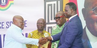 President Akufo-Addo (left) receiving a citation from Dr Yaw Adutwum after the launch of the NSS Policy in Accra. With them are Osei Assibey Antwi (2nd from left) and Nii Odoi Tetteyfio, Board Chairman, NSS. Picture: SAMUEL TEI ADANO