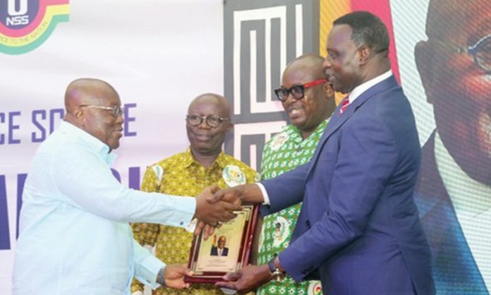 President Akufo-Addo (left) receiving a citation from Dr Yaw Adutwum after the launch of the NSS Policy in Accra. With them are Osei Assibey Antwi (2nd from left) and Nii Odoi Tetteyfio, Board Chairman, NSS. Picture: SAMUEL TEI ADANO