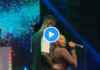 Sefa dances with male fan on stage