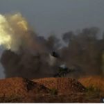 Israeli artillery units fire at an undisclosed target in the Gaza Strip on 7 May 2024.