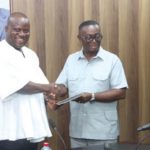 Andy Appiah Kubi (right), Chairman of the Devesting Committee and Member of Parliament for Asante-Akim North Constituency, presenting the report to Samuel Abu Jinapor (left), Minister of Lands and Natural Resources, after the meeting with the committee. Picture: ELVS NII NOI DOWUONA