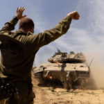 An Israeli soldier directed a tank near the border with the southern Gaza Strip on Thursday. AMIR LEVY/GETTY IMAGES