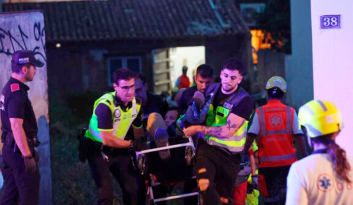 Medics taking injured people from a building that collapsed in Playa de Palma on the Spanish Mediterranean island of Mallorca. Picture: Isaac Buj/Europa Press/AP