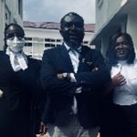 Ama Governor (in mask) with Oliver Barker-Vormawor (middle) and a colleague lawyer