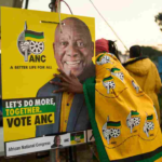 African National Congress (ANC) polling agents set up a tent decorated with party paraphernalia outside a polling station in Umlazi on May 29, during South Africa's general election. Zinyange Auntony/AFP via Getty Images