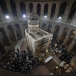 Latin Patriarch of Jerusalem Pierbattista Pizzaballa leads the Easter Sunday Mass at the Church of the Holy Sepulchre, where many Christians believe Jesus was crucified, buried and rose from the dead, in the Old City of Jerusalem, Sunday, March 31, 2024. The heads of major Christian denominations in Israel say that local governments across the country are demanding they pay property tax, violating a longstanding arrangement in a manner they say reflects growing intolerance for Christians in the Holy Land. (AP Photo/Leo Correa, File)