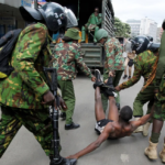 Police officers detain a man during a demonstration over police killings of people protesting against Kenya's finance bill, in Nairobi, Kenya, on June 27, 2024. Monicah Mwangi/Reuters