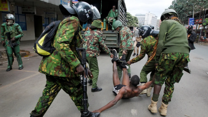 Police officers detain a man during a demonstration over police killings of people protesting against Kenya's finance bill, in Nairobi, Kenya, on June 27, 2024. Monicah Mwangi/Reuters