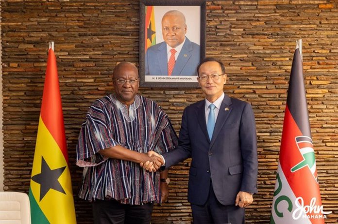Former President John Dramani Mahama (left) in a handshake with the Ambassador of South Korea, Park Kyongsig