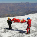 Police carry a body identified as US mountain climber Bill Stampfl, on Mount Huascaran in Huaraz, Peru, on July 5, 2024. Peruvian National Police/AP
