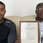 Nelson Shardey (r), seen here with his son Jacob, won a police commendation for bravery