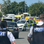 Emergency services and police are seen at the scene of a stabbing in Southport, England on Monday. ChauffeurWest/X via PA Wire