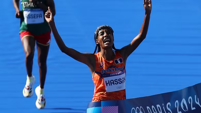 Hassan wins marathon to claim third Paris medal