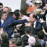 MPs exchange blows in parliament over ousted member