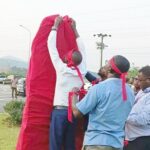 Members of the VRA Senior Staff Association pulled red cloths on symbolic items on the company’s premises