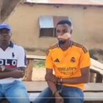 The victim [R] in a shot with a party executive during a visit