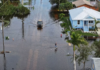 Joe Raedle / Getty Images Residents had to wade through floodwaters after heavy rain in Punta Gorda