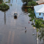 Joe Raedle / Getty Images Residents had to wade through floodwaters after heavy rain in Punta Gorda