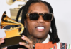 Getty Images | Lil Durk holding the Grammy Award he won for best melodic rap performance in February