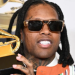 US rapper Lil Durk arrested over murder-for-hire plot Getty Images | Lil Durk holding the Grammy Award he won for best melodic rap performance in February