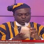 Martin Kpebu is seen holding the porridge on live TV