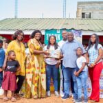 Mr Michael Abbiw presenting the items to Madam Owusu, CEO of Potter's Village