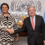 Secretary-General António Guterres (right) swears in Hannah S. Tetteh, Director-General of the United Nations Office at Nairobi.