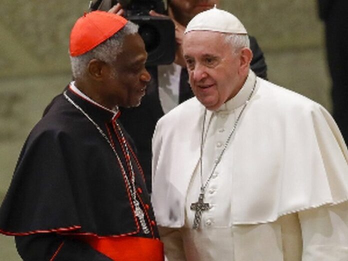 Cardinal Peter Appiah Turkson (L) with Pope Francis Cardinal Peter Appiah Turkson (L) with Pope Francis