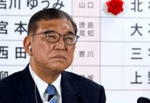 Japan’s PM vows to stay on despite bruising election loss