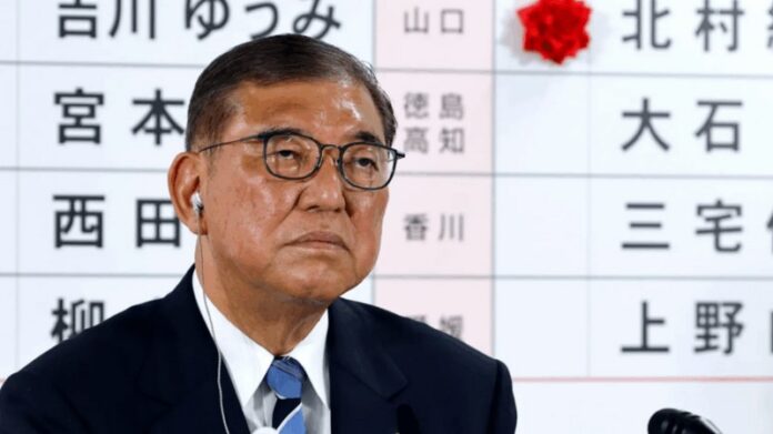 Shigeru Ishiba took questions from journalists at his party's Tokyo headquarters in the hours after the polls closed