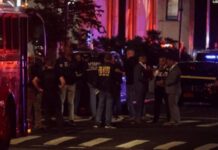 Police officer among four dead in shooting at New York City office building