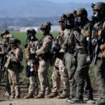 Trump asks US Supreme Court to lift limits on immigration raids