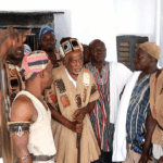 Wa Naa performs historic cow-crossing with staff at Dumba Festival