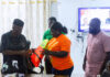 Oti Regional Minister, John Kwadwo Gyapong being presented with some life jackets