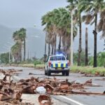 Jamaicans wake to devastation as hurricane causes floods, power cuts and splits city in two