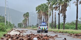 Jamaicans wake to devastation as hurricane causes floods, power cuts and splits city in two