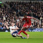Liverpool hold on to beat nine-man Tottenham