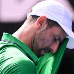 Djokovic scrapes into semis after Musetti injury