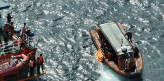 Indonesian rescuers find a second body as search for Spanish soccer coach and 2 children extended