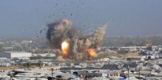 Israeli air strikes kill at least 32 Palestinians in Gaza, rescue officials say