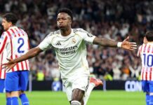Vinicius double helps Real Madrid edge Atletico thriller