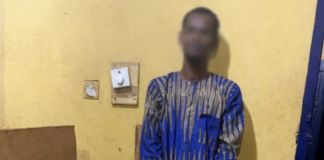 Suspected robber dies after leaping from moving police vehicle