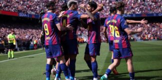 Leaders Barcelona hang on to beat Rayo Vallecano