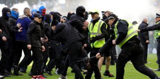 ‘Shameful’ pitch invasion by Celtic and Rangers fans condemned by police