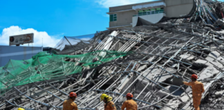 Philippines building collapse: Rescuers search for more than 20 trapped