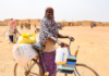 Mother-of-six Zourata after receiving food aid from the World Food Program in May 2024, in Titao, Burkina Faso. Photo: WFP/Emily Pinna